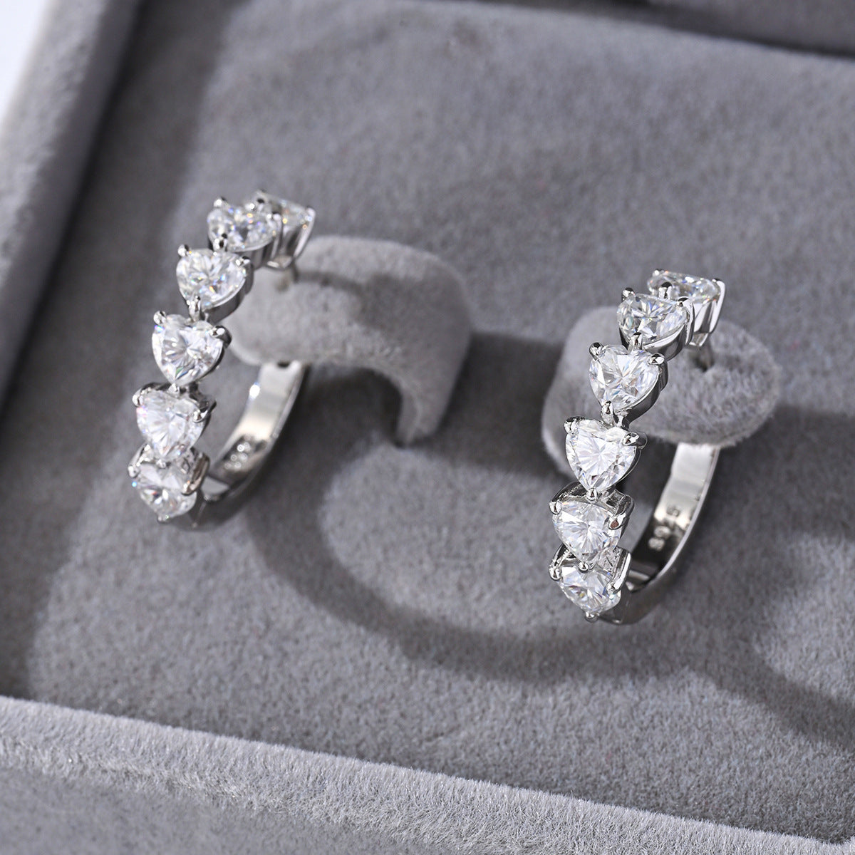 Yellow gold 8mm heart moissanite studs on neutral background. Alt: “8mm Heart Moissanite Earrings – 18K Yellow Gold.”