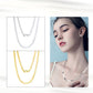 Female model wearing the necklace alone on bare skin.