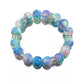 Multicolored beaded bracelet with silver accents on a white background