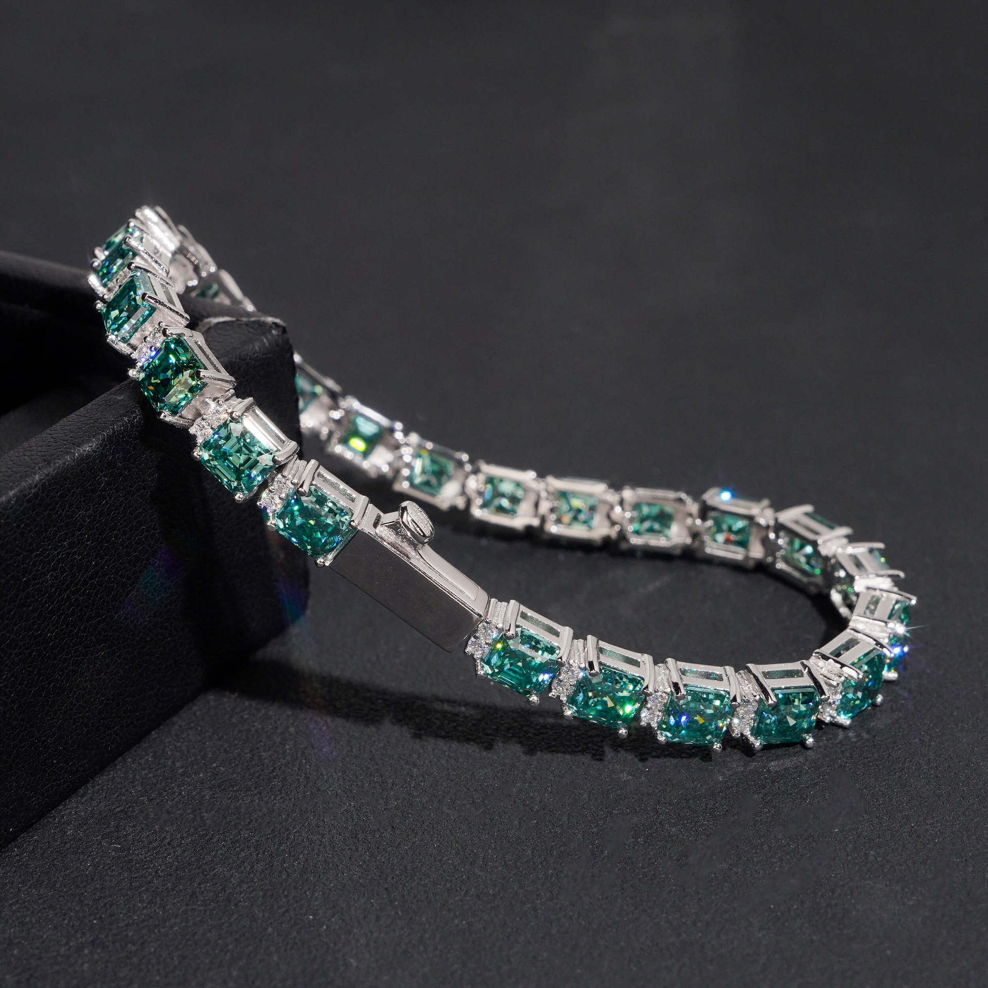 Include a second image showing the bracelet from a slight angle to reveal the step-cut faceting and hall-of-mirrors effect.