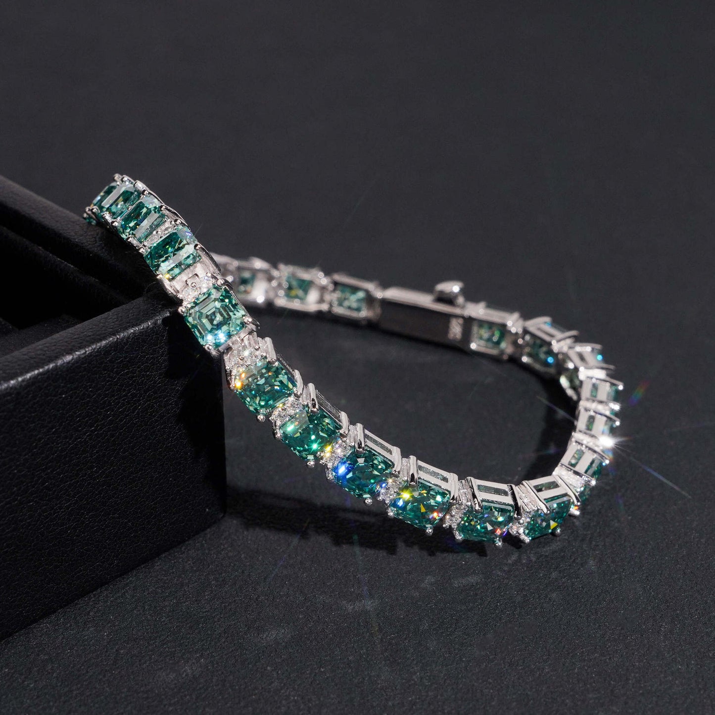 Include a second image showing the bracelet from a slight angle to reveal the step-cut faceting and hall-of-mirrors effect.