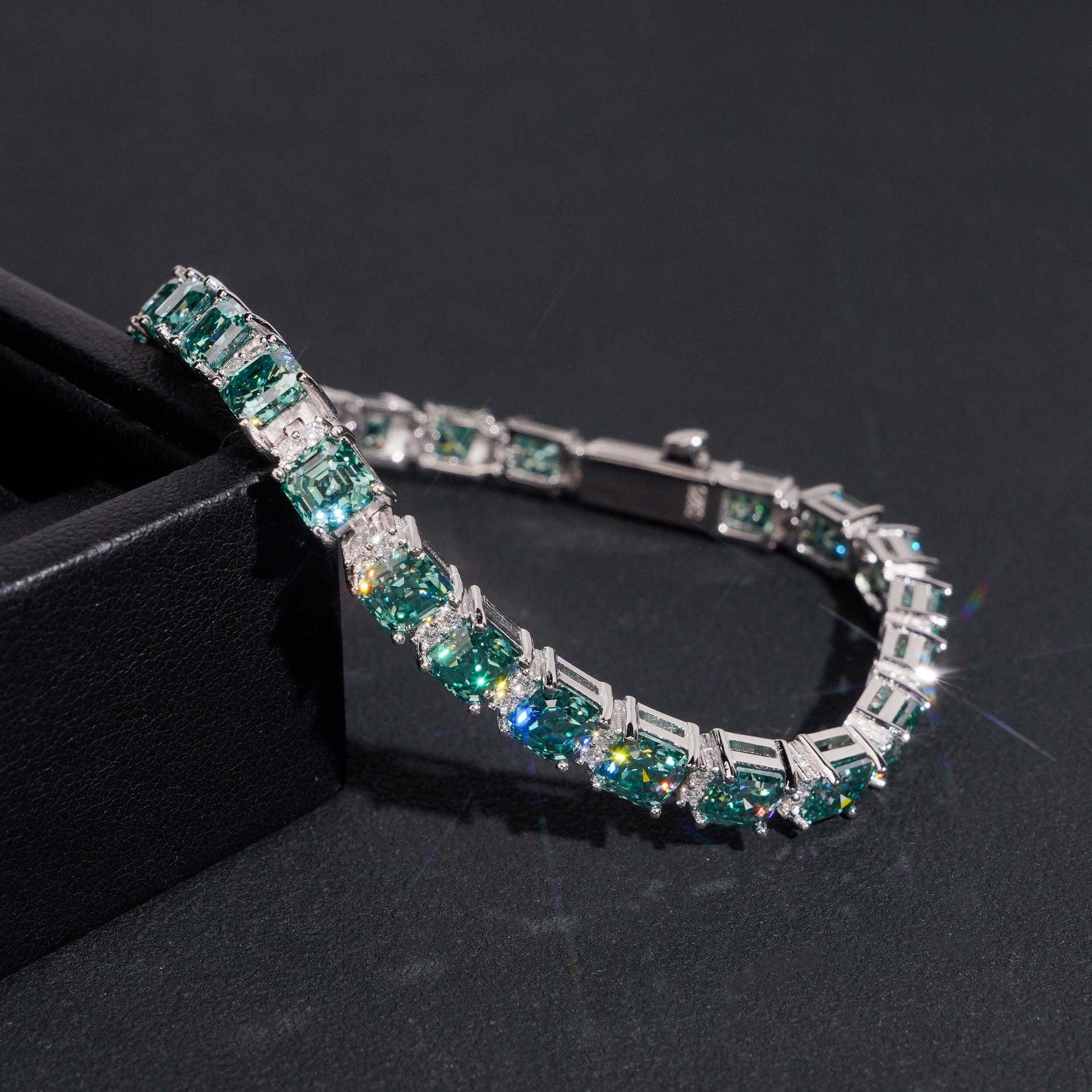 Include a second image showing the bracelet from a slight angle to reveal the step-cut faceting and hall-of-mirrors effect.