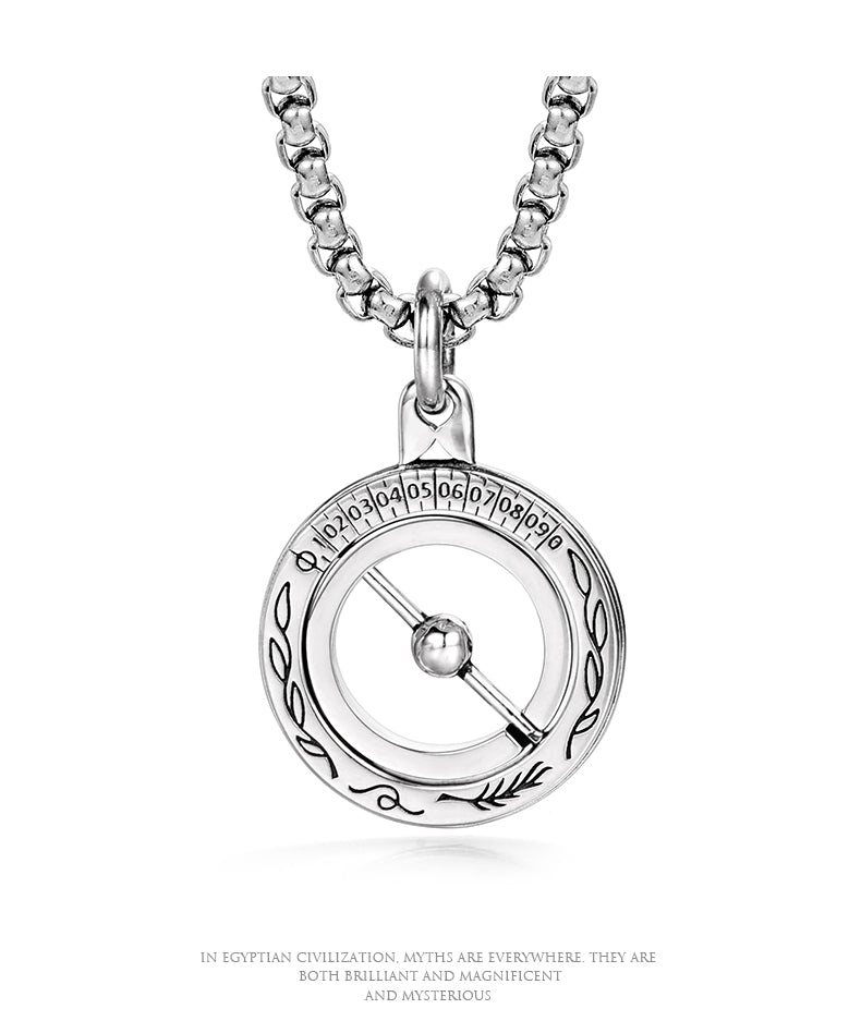“Men’s astronomical sphere necklace flat lay on white background”