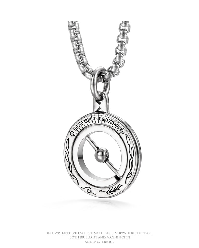 “Close-up of astronomical sphere pendant with rotating ring structure”