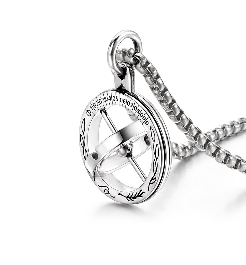 “Close-up of astronomical sphere pendant with rotating ring structure”