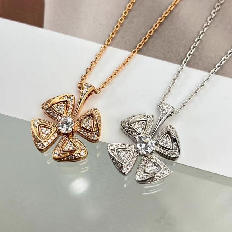 BVLGARI Fiorever Necklace Fiorever 18 k rose gold necklace necklaces, one gold and one silver, on a reflective surface.