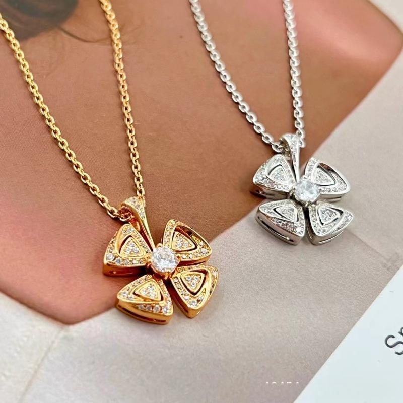 BVLGARI Fiorever Necklace Fiorever 18 k rose gold necklace in gold and silver on a person wearing a white top.