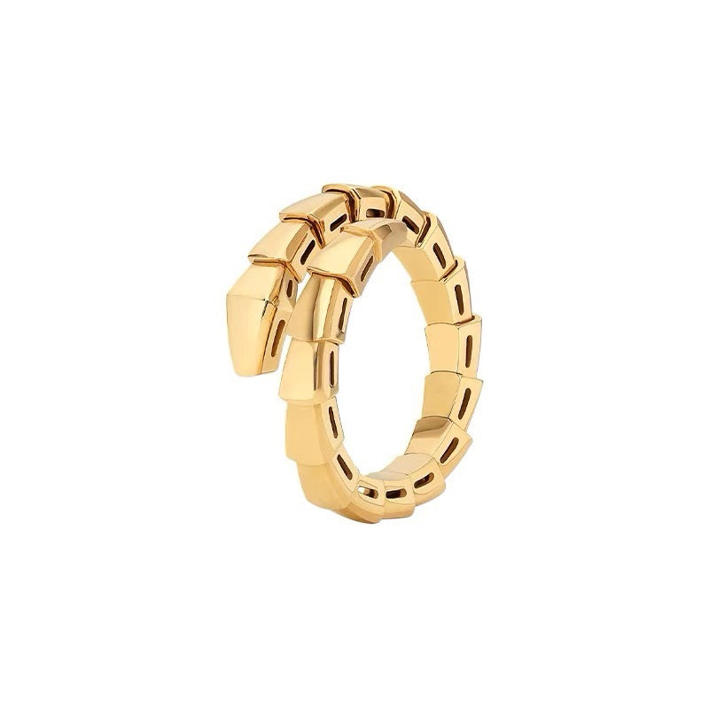 A gold snake ring with a textured, scaled design, shown on a plain white background.