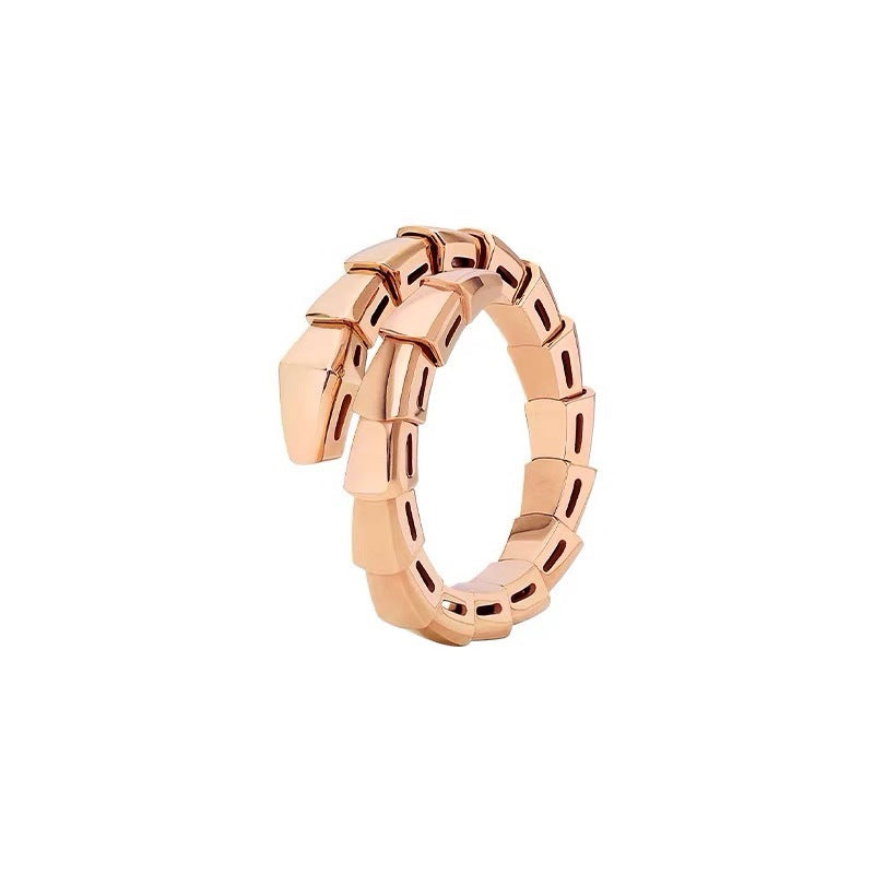 A rose gold Bvlgari Serpenti ring, featuring a coiled snake head design with a polished metallic finish, set against a plain white background.