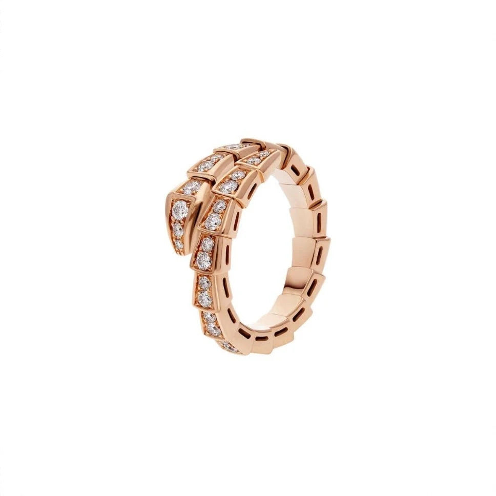 A rose gold snake ring with clear gemstones, shown on a plain white background.