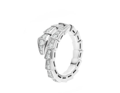 A silver-toned snake ring featuring channel-set round and baguette diamonds, presented on a clean white background.