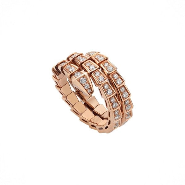 A rose gold ring with a distinctive geometric, stacked-link design paved with small clear stones, shown on a plain white background.