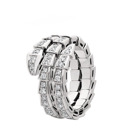 Silver ring with diamond accents on a white background
