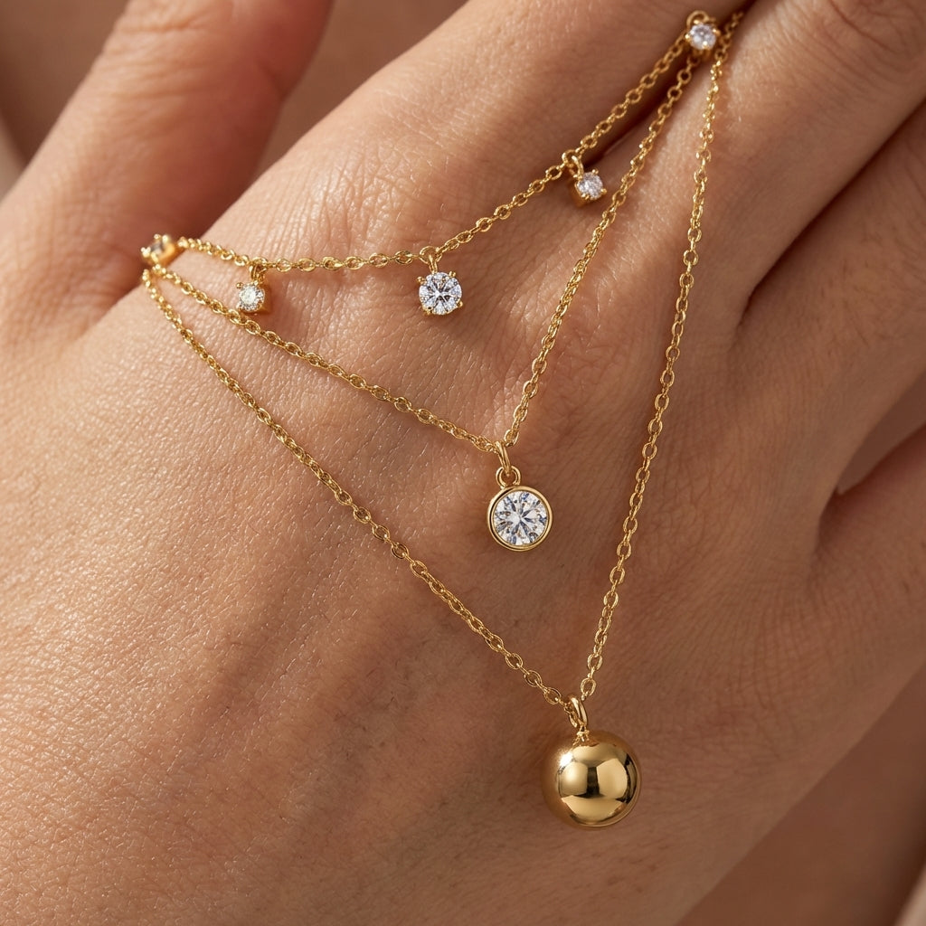 Macro, necklace draped across female hand, natural curve, warm soft light, mirror metal shine, sharp sparkle, blurred skin background, detailed texture, intimate luxury feel.