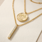 Extreme macro close-up of the necklace pendant, mirror-polished metal, sparkling stone facets under focused light, clean cream textured background, ultra-detailed luxury jewelry photography.