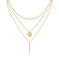 Clean white background — both necklaces layered elegantly on a bust form. The moissanite bar catches soft light, showing subtle sparkle; the polished coin pendant sits slightly lower. Chains drape smoothly without tangling.
