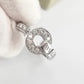 Silver ring with gemstones on a light background