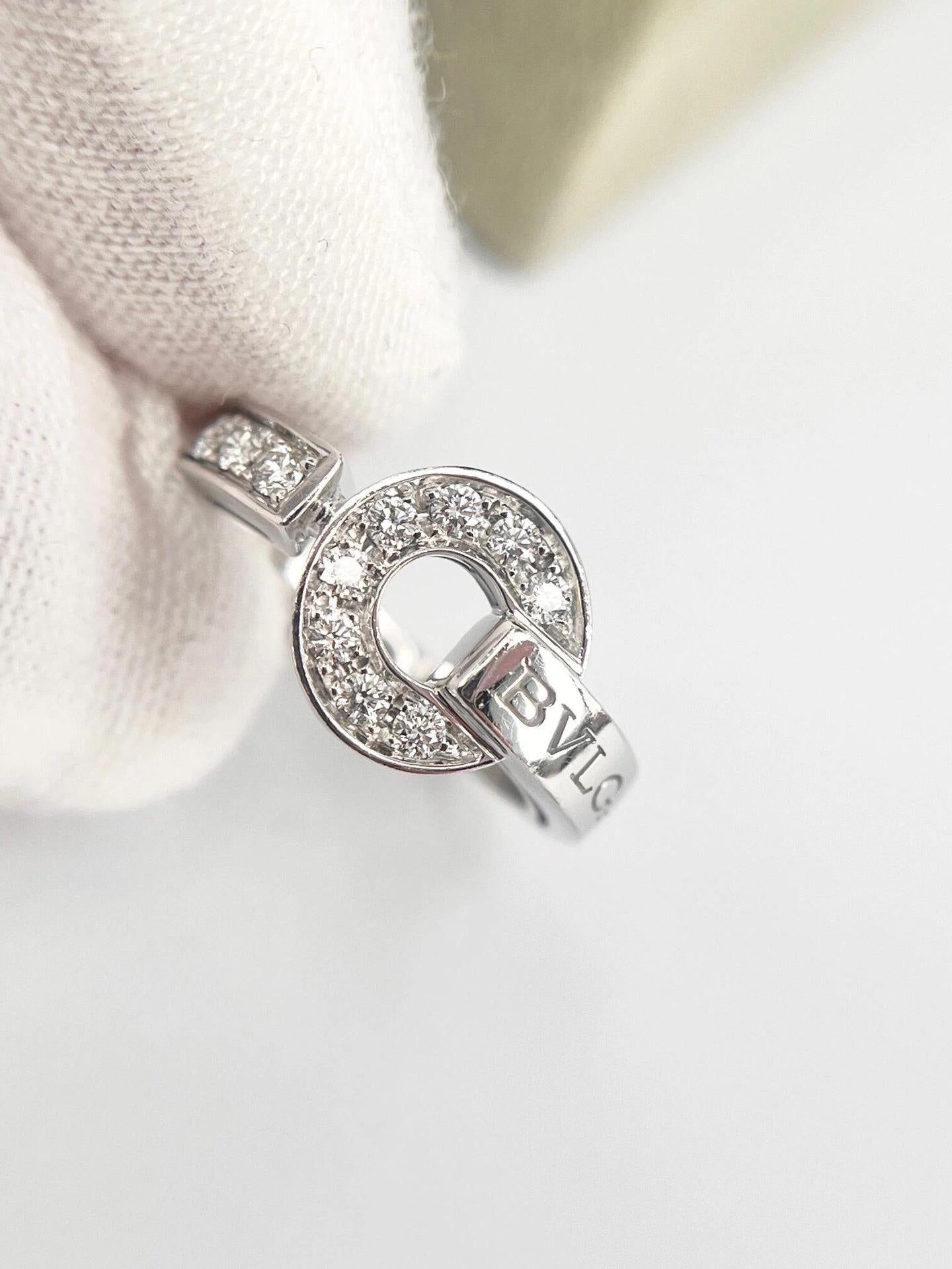 Silver ring with gemstones on a light background