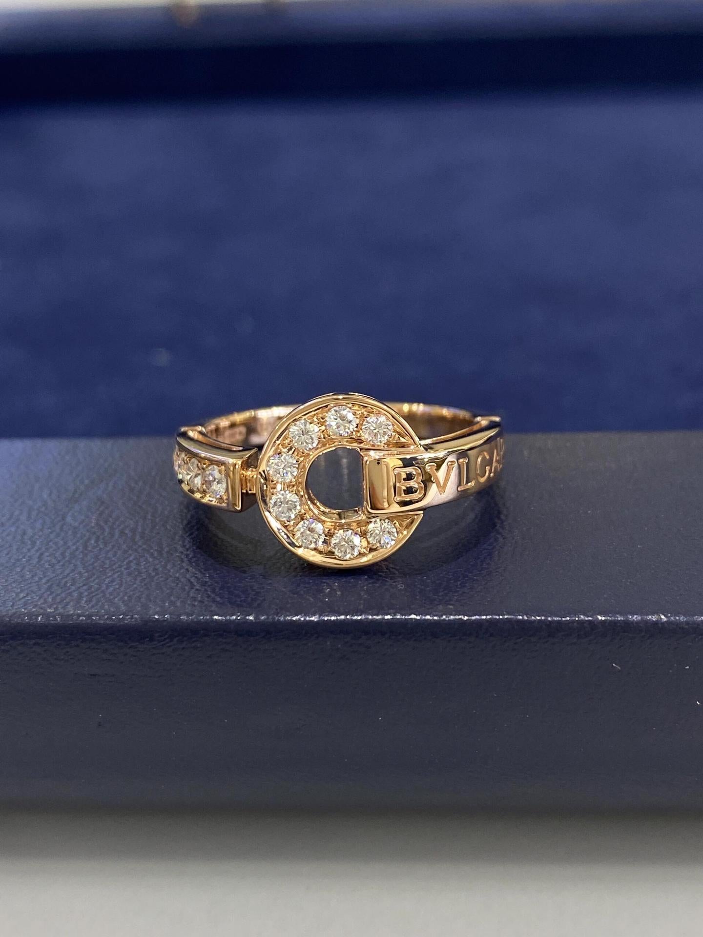 Gold ring with diamond accents on a blue background