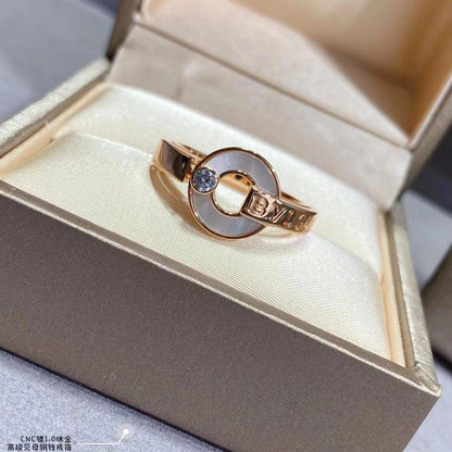 Gold ring with a blue gemstone in a jewelry box