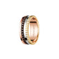 Three-toned ring with 'BOUCHERON' branding on a white background