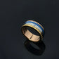 Gold and blue ring on a black background