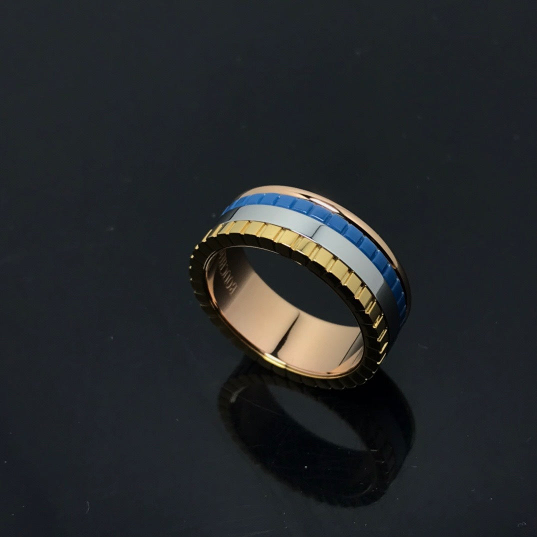 Gold and blue ring on a black background