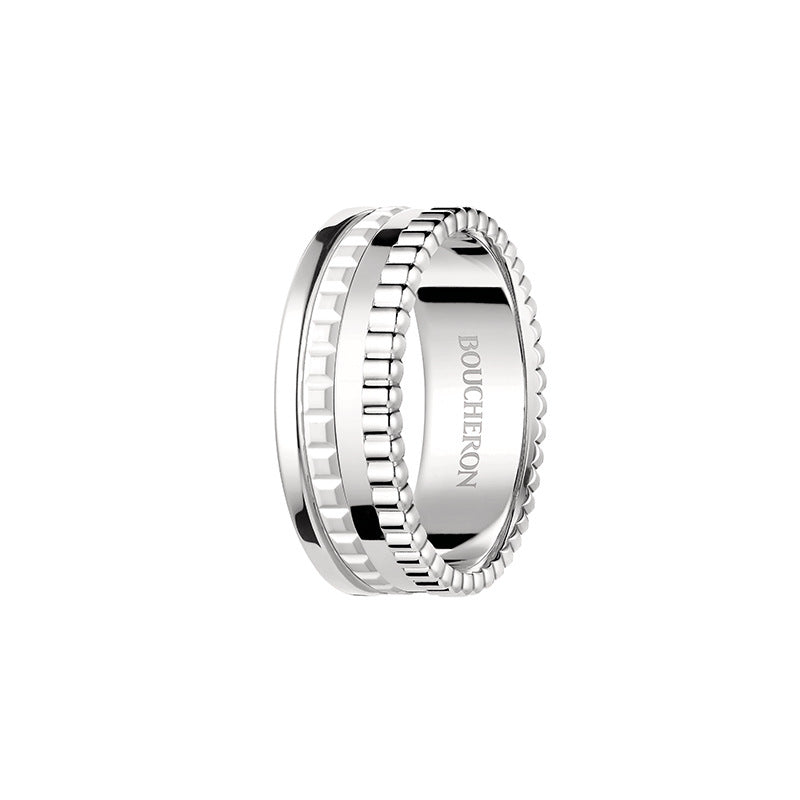 Silver ring with 'Boucheron' engraving on a white background