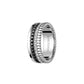 Silver ring with diamond accents on a white background