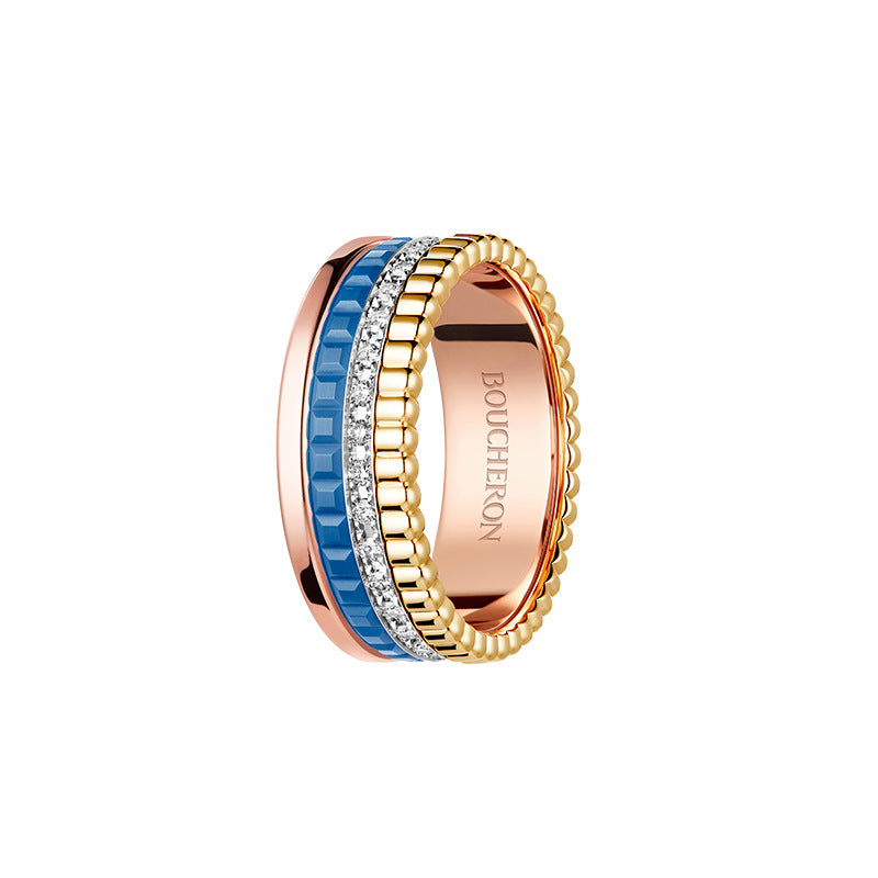 Boucheron ring with blue and rose gold design on a white background