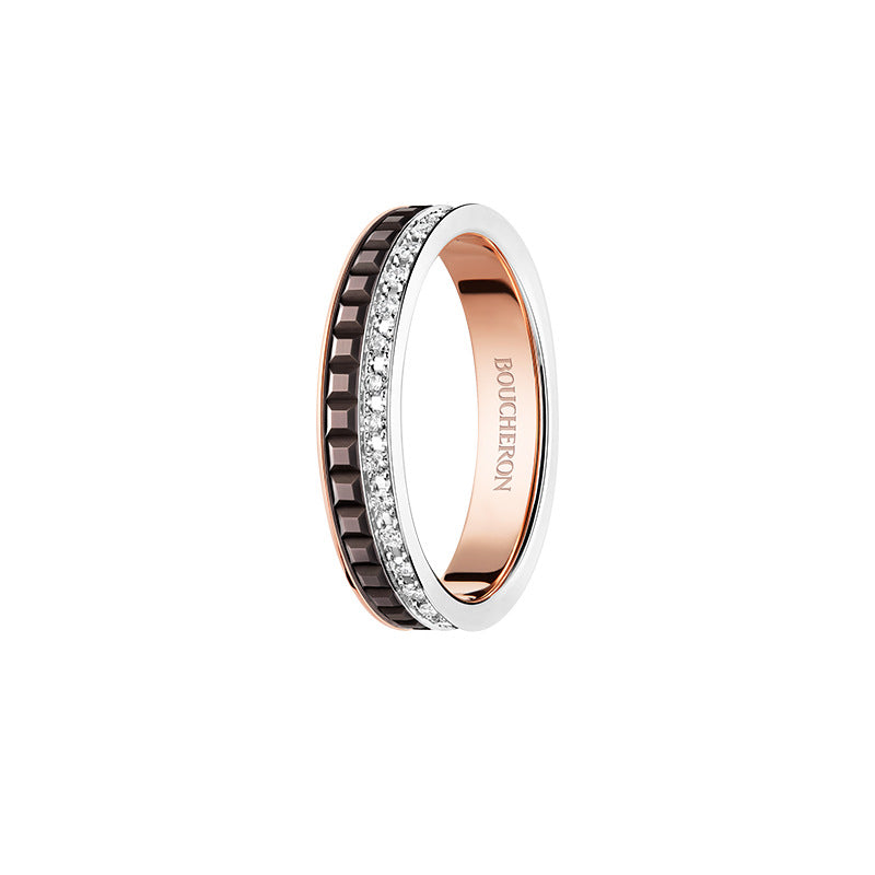 Rose gold ring with diamond accents on a white background