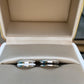 Boucheron cufflinks in an open jewelry box