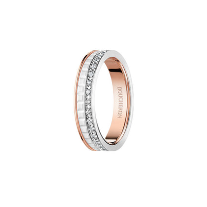 Rose gold ring with diamond accents on a white background
