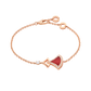 Rose gold bracelet with a red heart charm on a white background