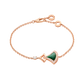 Rose gold bracelet with green gemstone on a white background