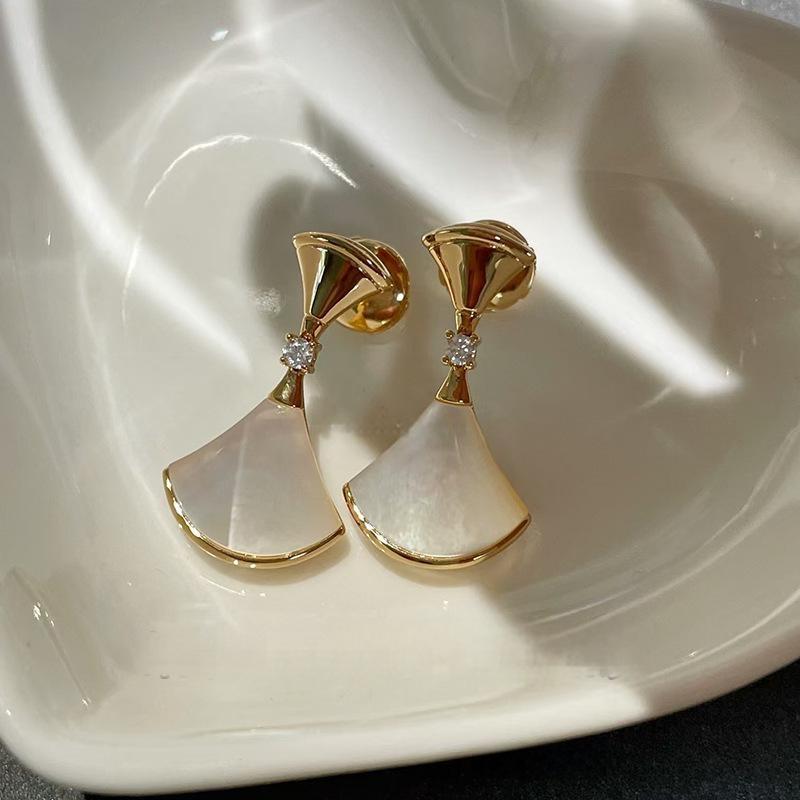 Bvlgari  Divas’ Dream Earringswith white stones on a white dish