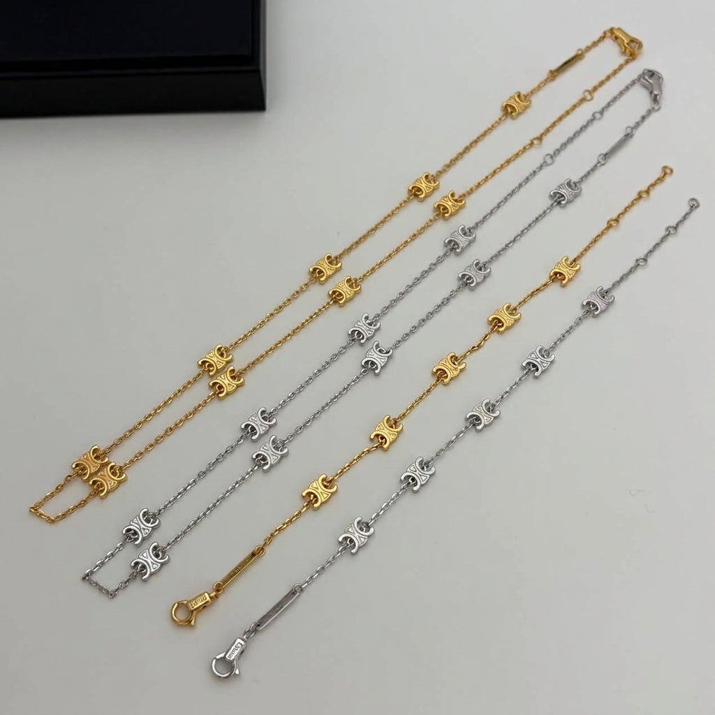 Four delicate chain bracelets laid out diagonally on a light gray surface, featuring repeating horse motif links in gold and silver-tone finishes. A small black jewelry box is partially visible in the top-left corner.
