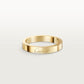 A slim yellow gold band ring engraved with the 'Cartier' logo, shown on a light gray gradient background.