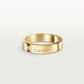 Gold Cartier ring with a diamond on a light gray background