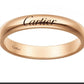 A rose gold Cartier band ring with the Cartier logo engraved on the top and 'Cartier' stamped inside the band, shown against a plain white background.