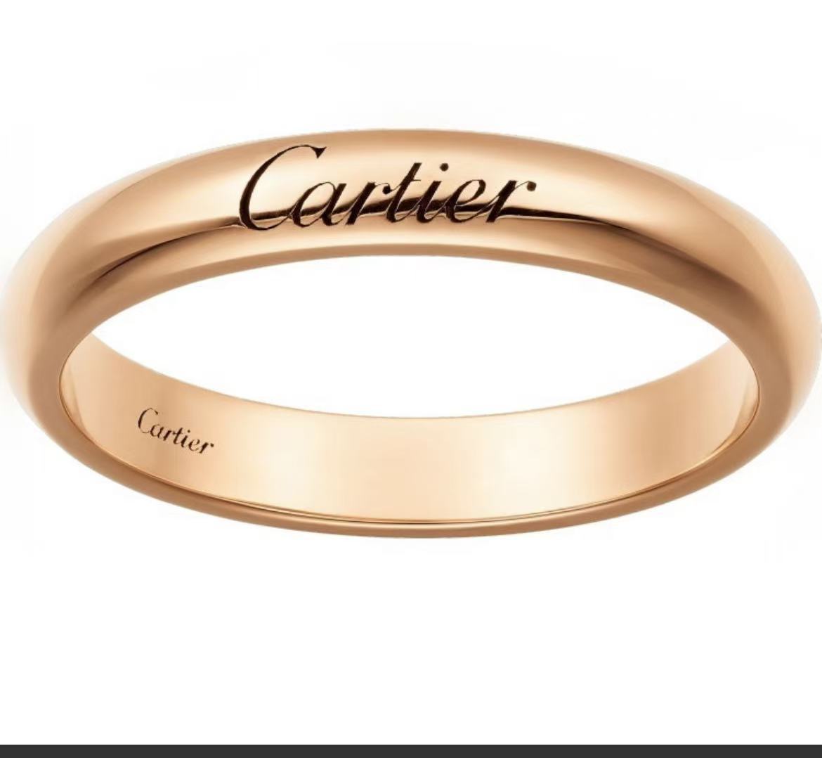 A rose gold Cartier band ring with the Cartier logo engraved on the top and 'Cartier' stamped inside the band, shown against a plain white background.