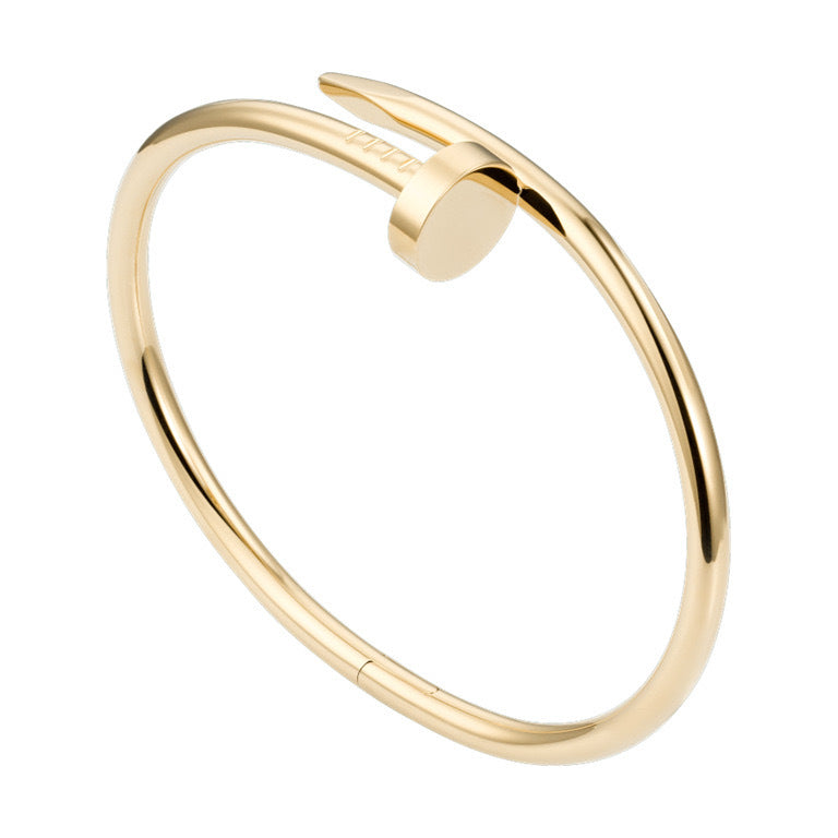 Gold bracelet on a white background