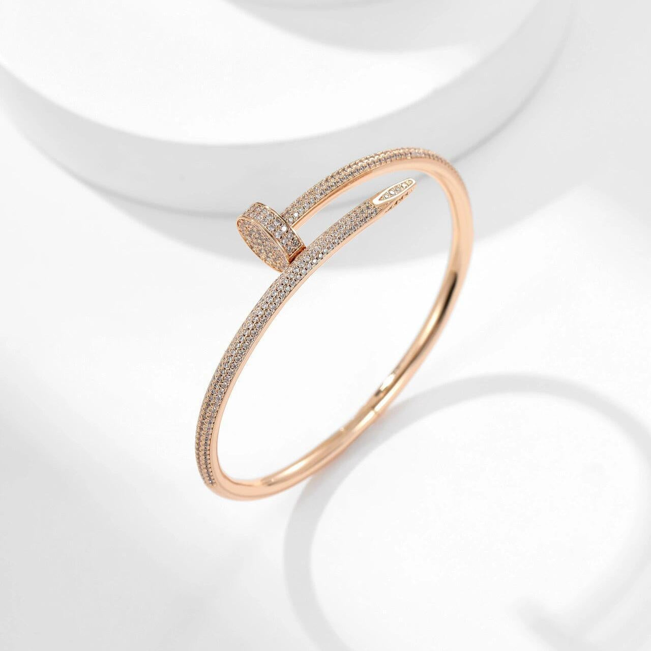 Rose gold bracelet on a white background