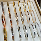 Set of gold and silver bracelets displayed in a box