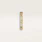 Gold bracelet with embedded diamonds on a light beige background