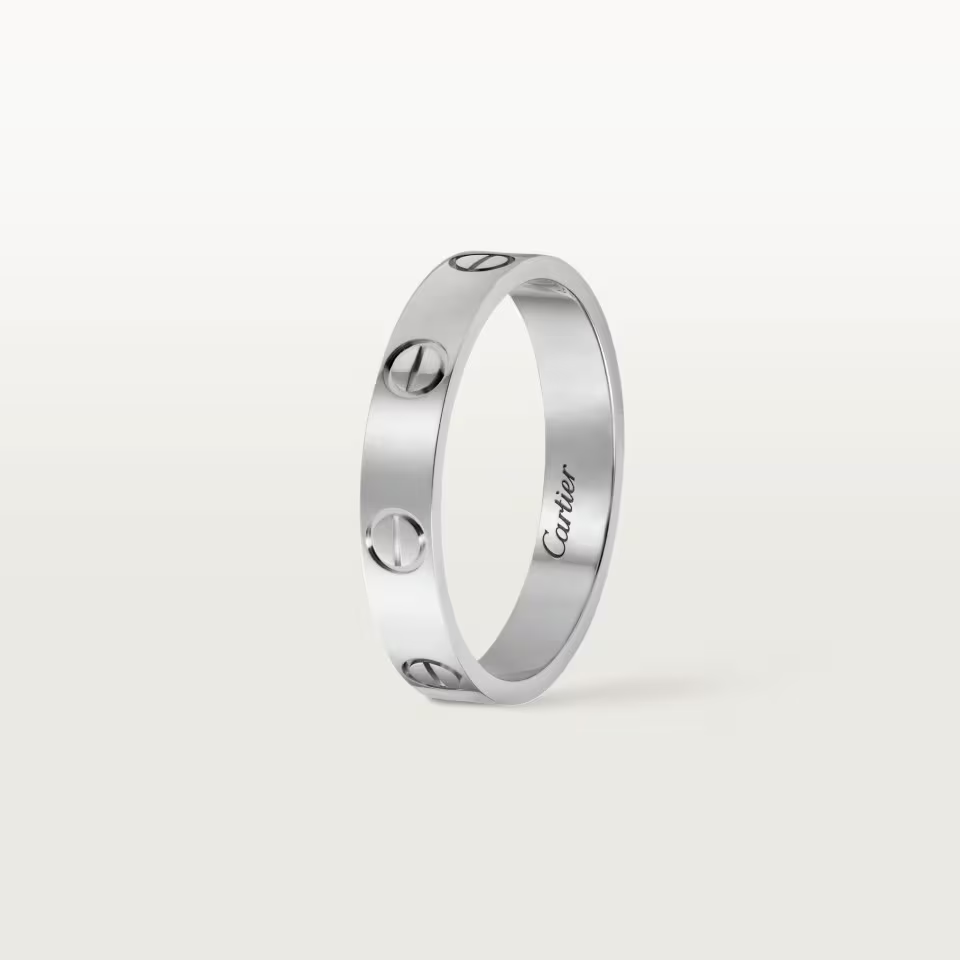 Silver Cartier ring on a white background