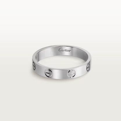 Silver Cartier ring on a white background