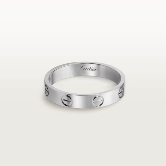 Silver Cartier ring on a white background