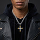 Man wearing a black leather jacket and a necklace with a cross pendant on a dark background