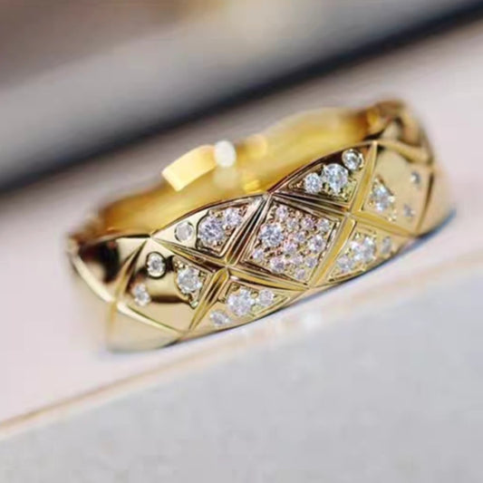 Chanel_COCO_CRUSH_RING_Diamondwith diamond accents on a light background